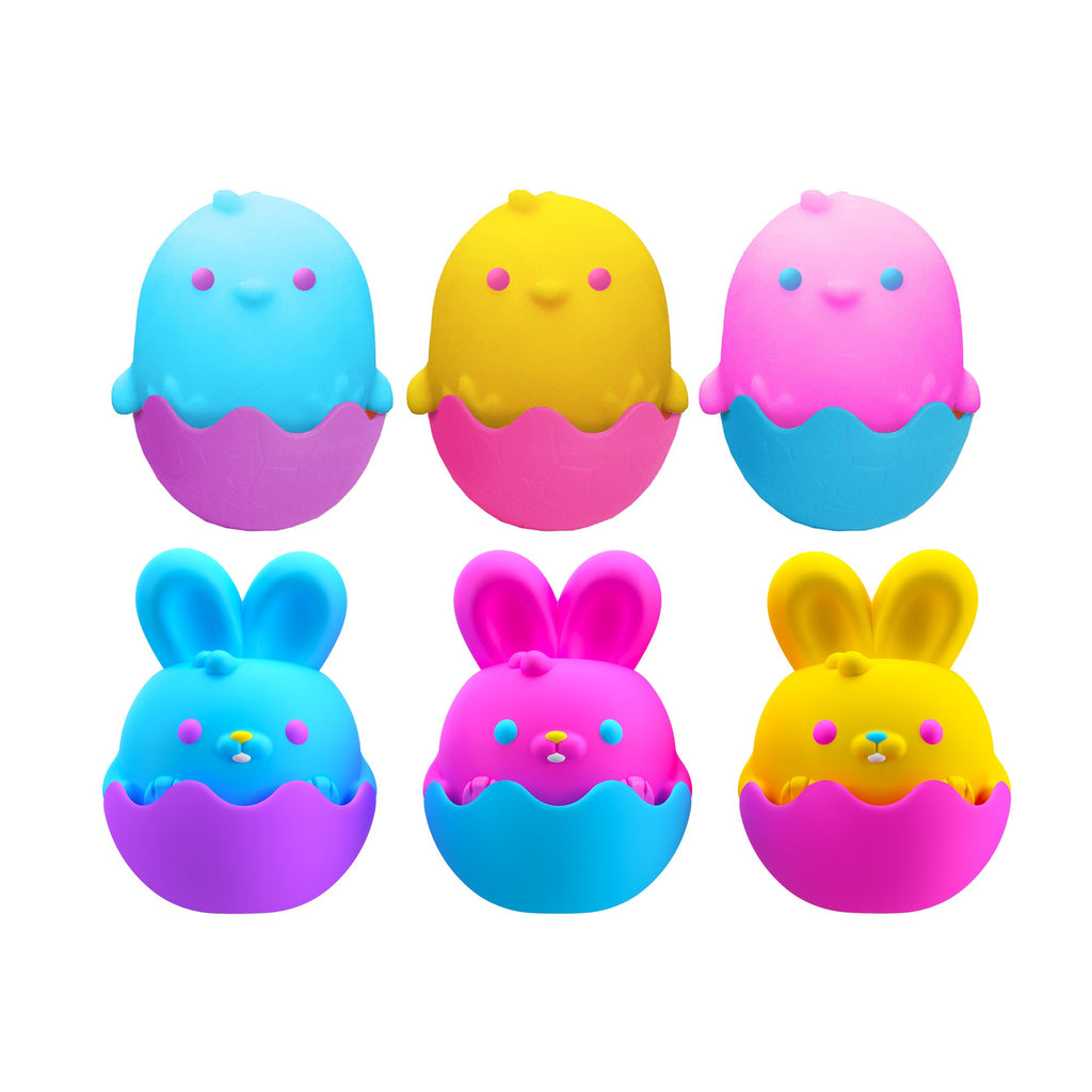 Six cartoonish egg-shaped characters are arranged in two rows. The top row features blue, yellow, and pink characters, while the bottom row shows the same characters but with bunny ears. Each character has a smiling face and is sitting in a cracked egg.