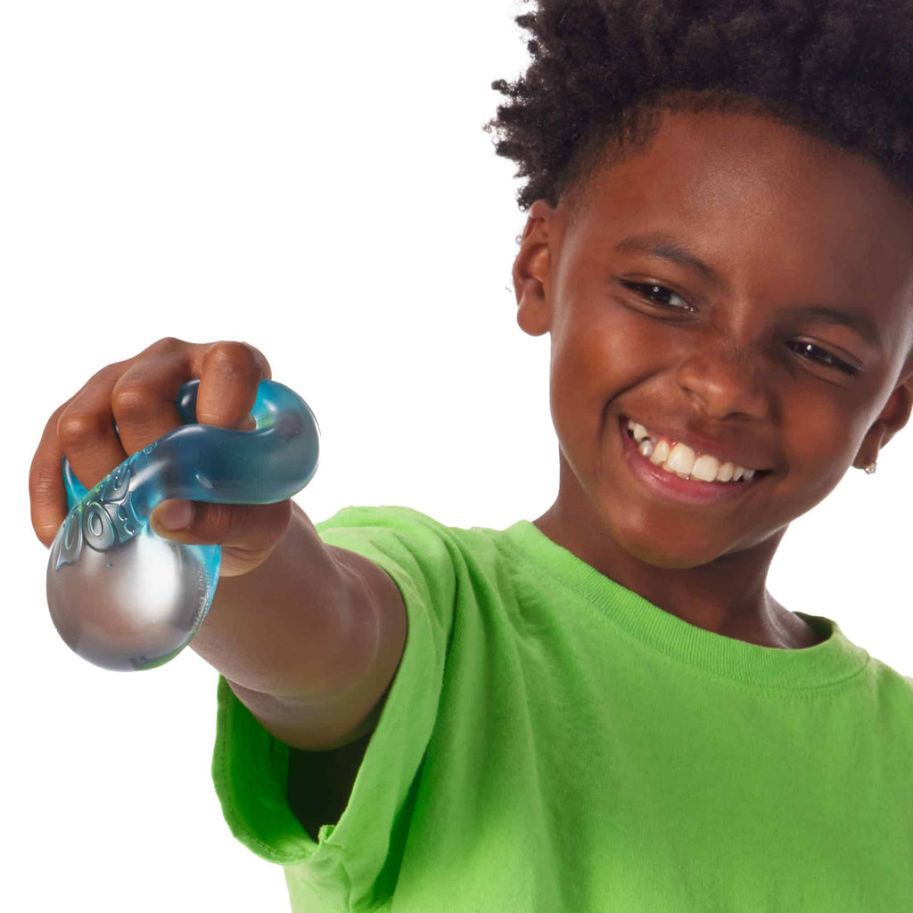 NeeDoh Nice Cube Lifestyle of boy squeezing blue Nice Cube